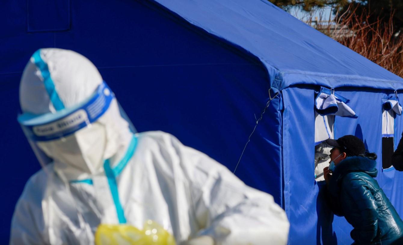 A woman is tested at a nucleic acid testing site following an outbreak of the coronavirus disease (COVID-19) in Beijing, China, January 18, 2021. - Avaz