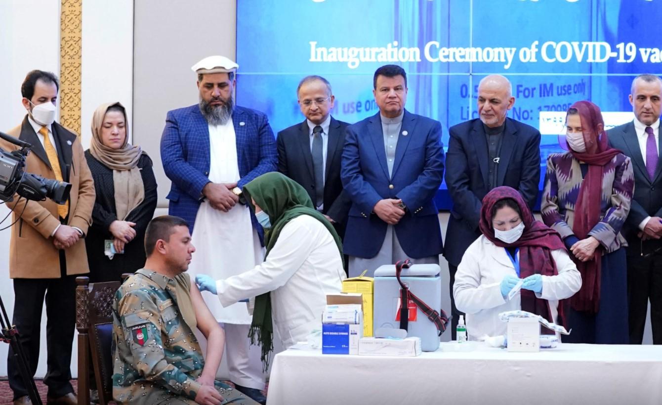 Members of Afghan security forces receive the first dose of AstraZeneca's COVID-19 vaccine from India, during a ceremony at the presidential palace in Kabul, Afghanistan February 23, 2021. - Avaz