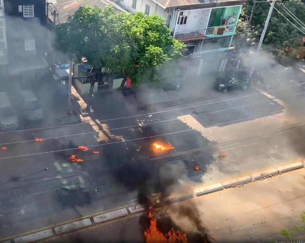 Smoke rise from burning objects during a protest in Yangon, Myanmar, March 4, 2021, in this still image taken from a video. - Avaz