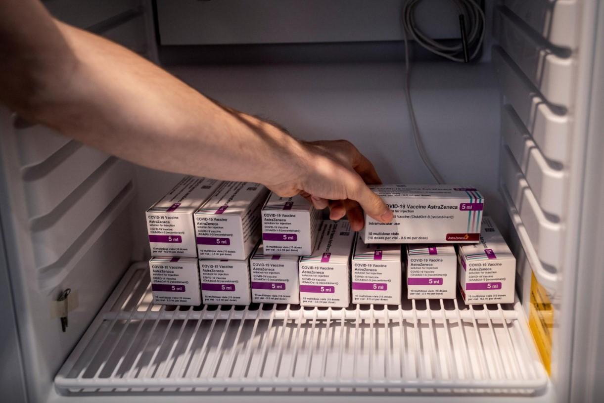 Staff member handles AstraZeneca COVID-19 vaccines in storage at Region Hovedstaden's Vaccine Center, Copenhagen, Denmark February 11, 2021. - Avaz