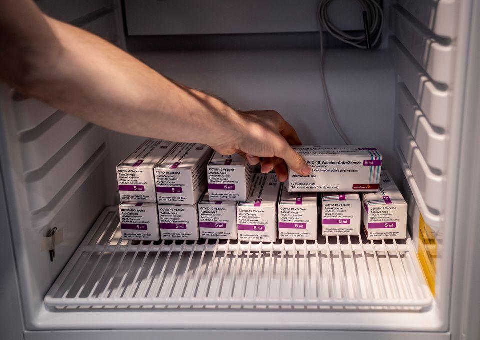 Staff member handles AstraZeneca COVID-19 vaccines in storage at Region Hovedstaden's Vaccine Center, Copenhagen, Denmark February 11, 2021. - Avaz