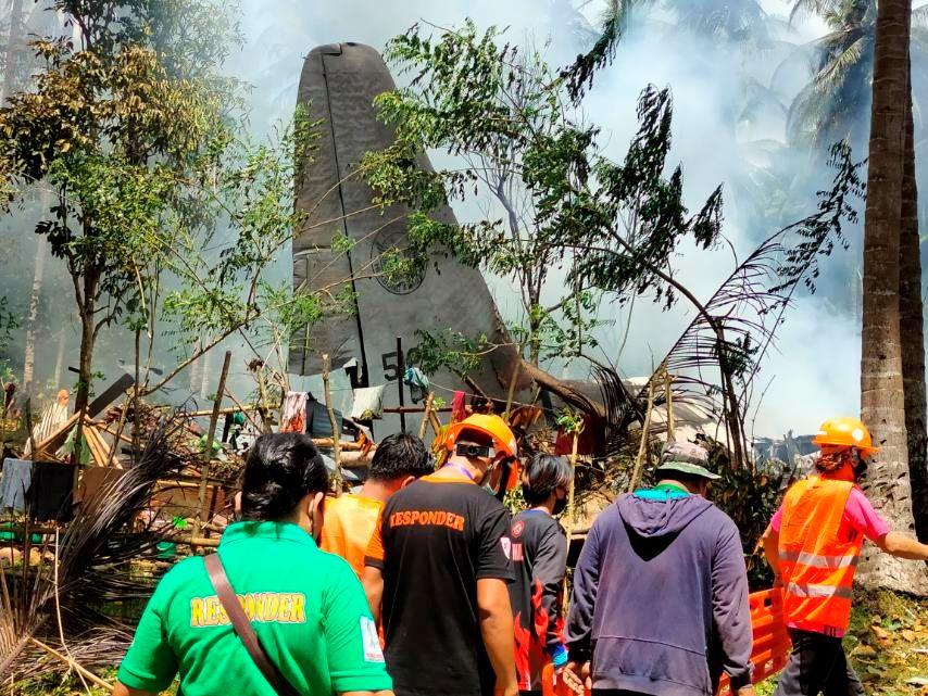 First responders work at the site after a Philippines Air Force Lockheed C-130 plane carrying troops crashed on landing in Patikul, Sulu province, Philippines July 4, 2021. Armed Forces of the Philippines - Joint Task Force Sulu - Avaz