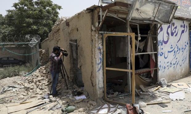 An Afghan journalist films the site of a bomb explosion in Kabul on 10 July. - Avaz